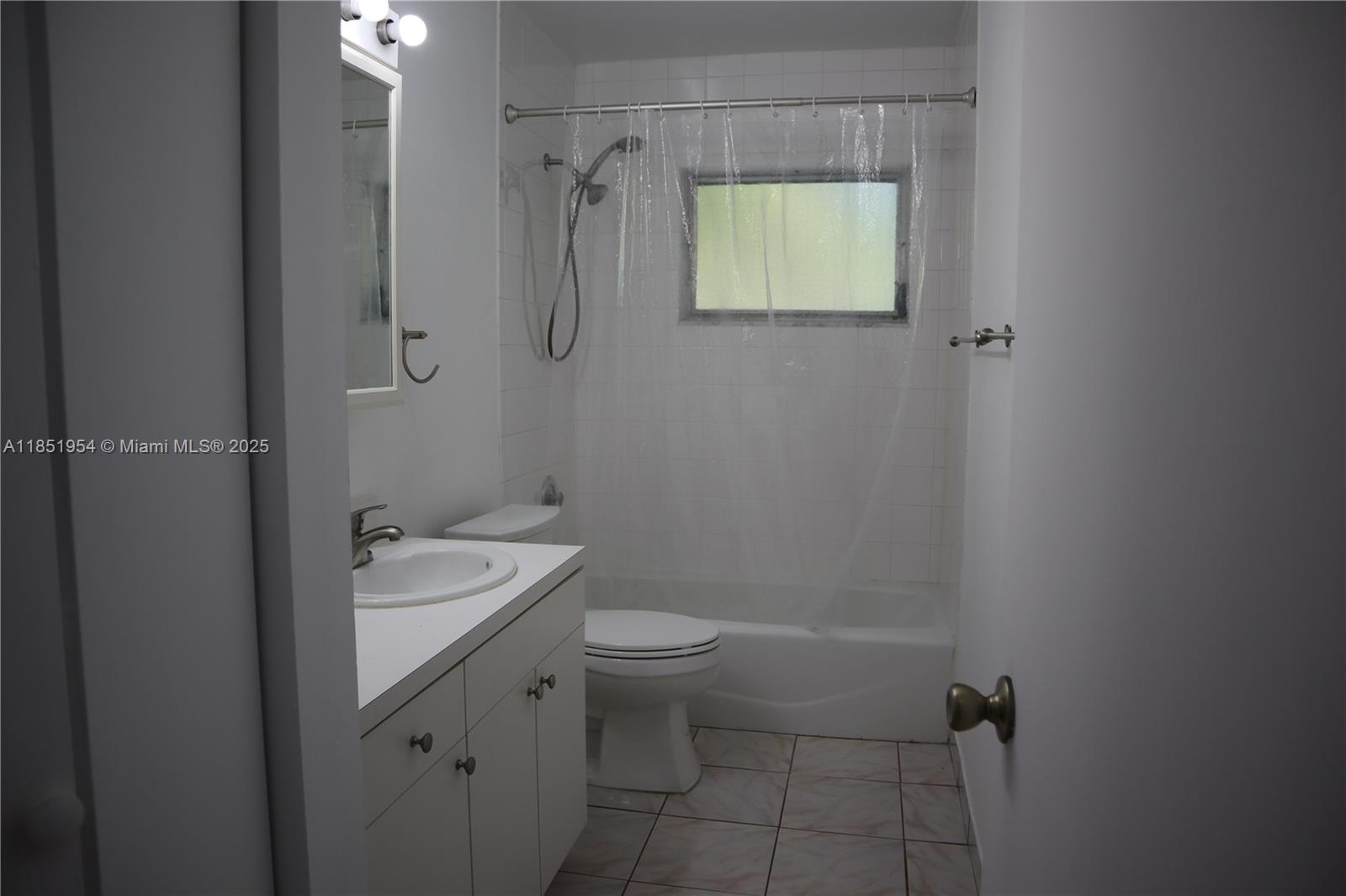 18531 Southwest 268th Street, Unit 18531 Homestead, FL 33031 - Photo 15 of 18 a bathroom with a granite countertop sink a toilet and shower