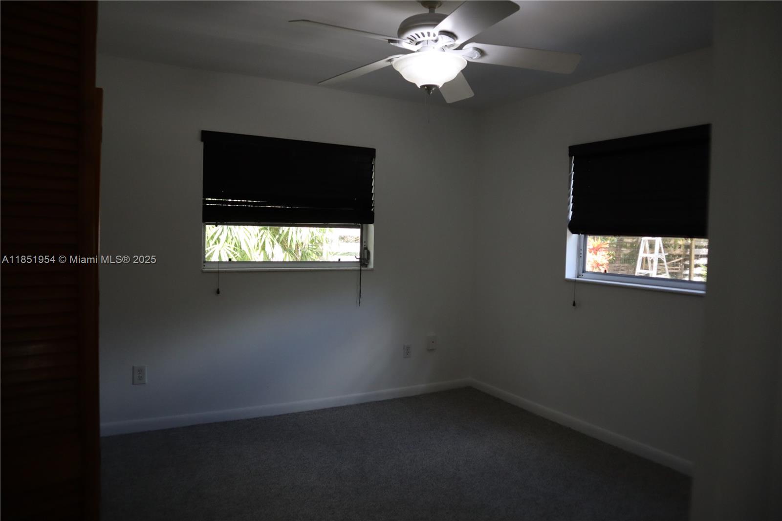 18531 Southwest 268th Street, Unit 18531 Homestead, FL 33031 - Photo 17 of 18 wooden floor in an empty room with a window