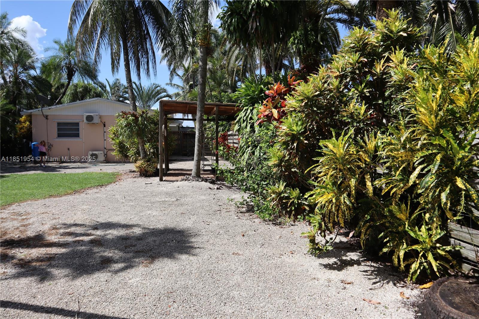 18531 Southwest 268th Street, Unit 18531 Homestead, FL 33031 - Photo 9 of 18 a view of a backyard