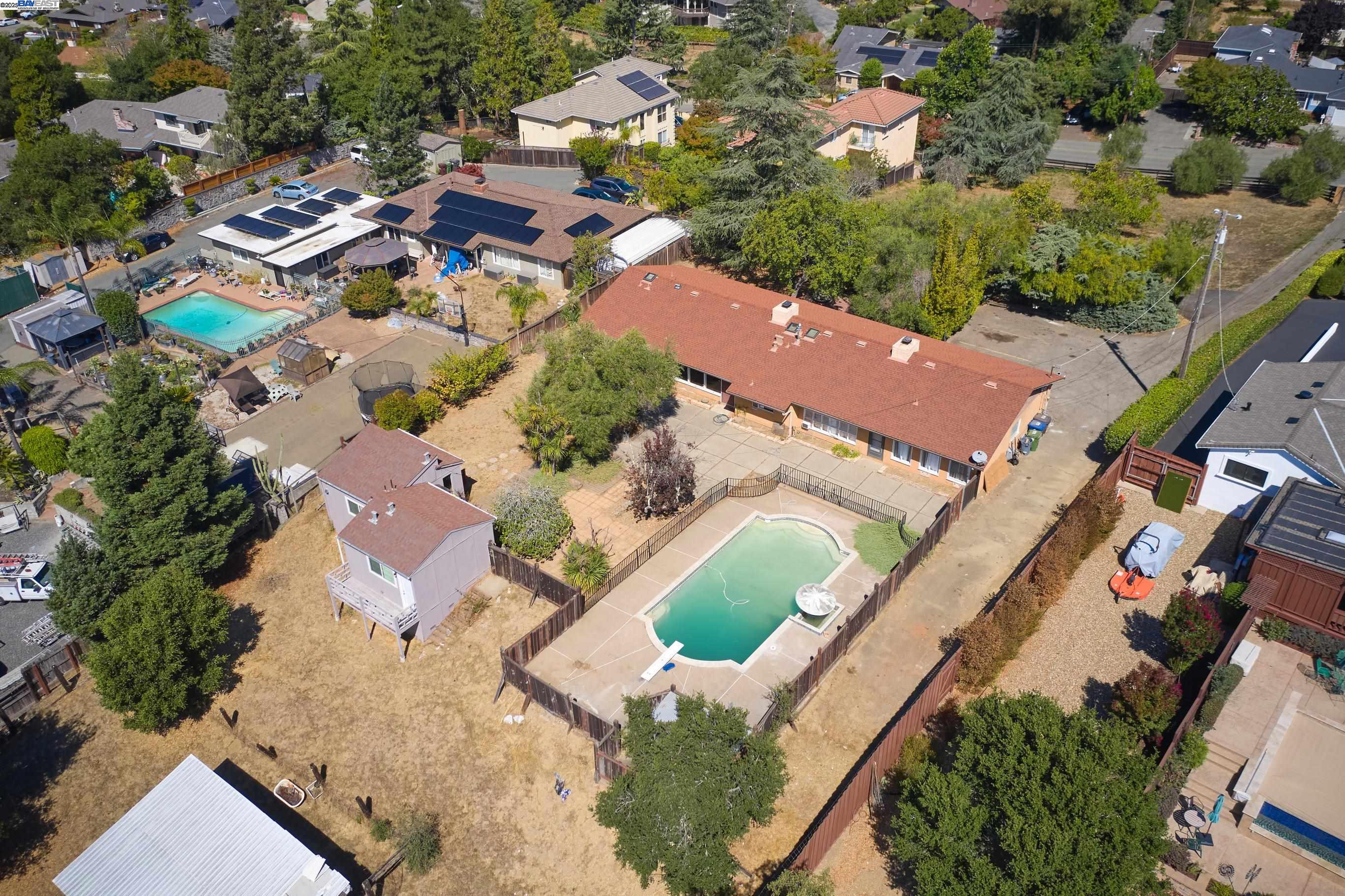an aerial view of residential houses with outdoor space