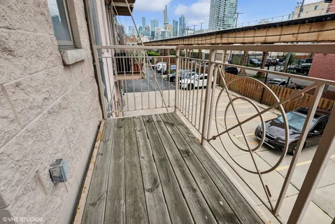 a view of balcony with wooden floor