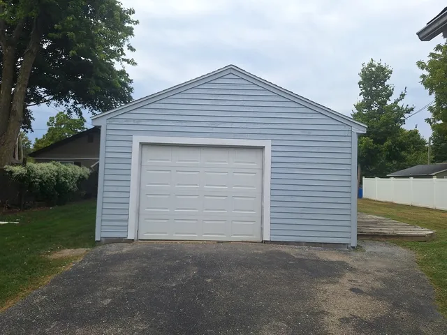 a view of a house with pool and a big yard