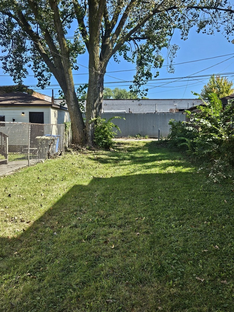5943 South Marshfield Avenue Chicago, IL 60636 - Photo 2 of 5 a view of a house with a yard