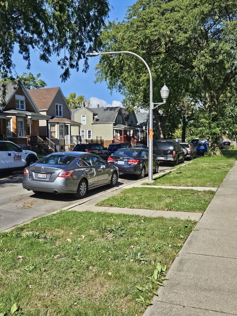 5943 South Marshfield Avenue Chicago, IL 60636 - Photo 3 of 5 a front view of a building with garden