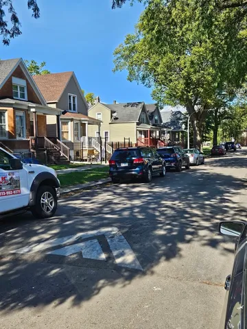 a view of street with parked cars