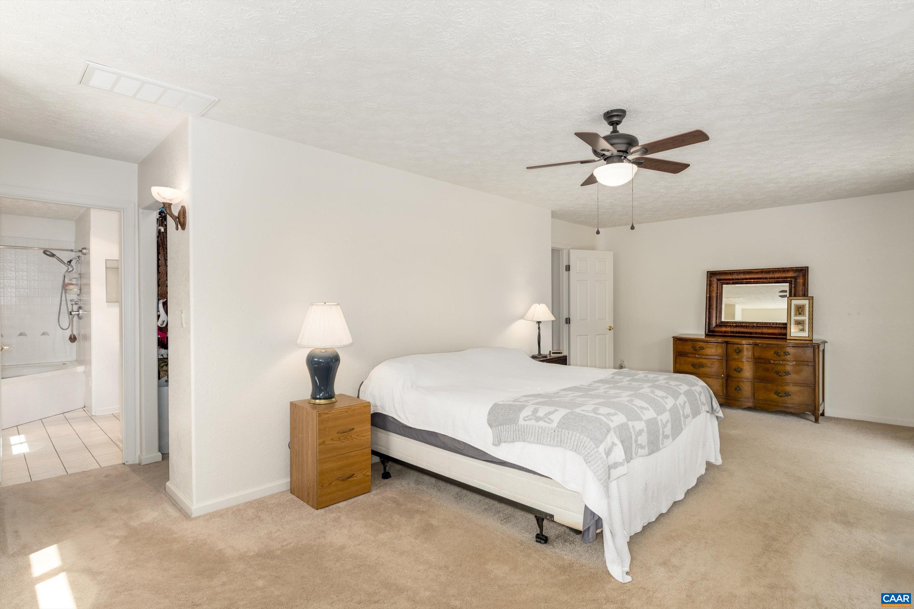 15365 Madison Run Road Gordonsville, VA 22942 - Photo 17 of 38 a bedroom with a bed and a tv
