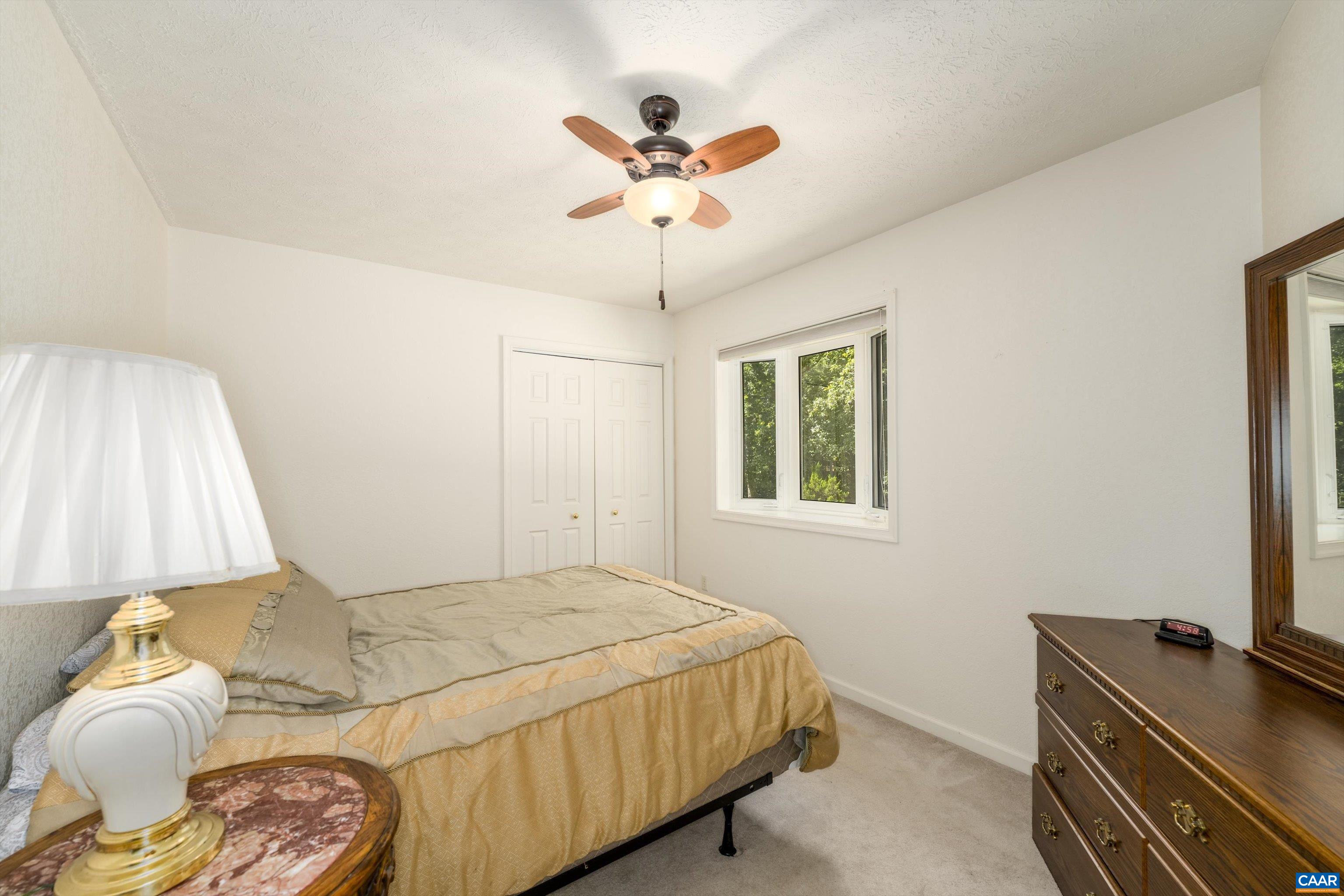 15365 Madison Run Road Gordonsville, VA 22942 - Photo 19 of 38 a bedroom with a bed and a window