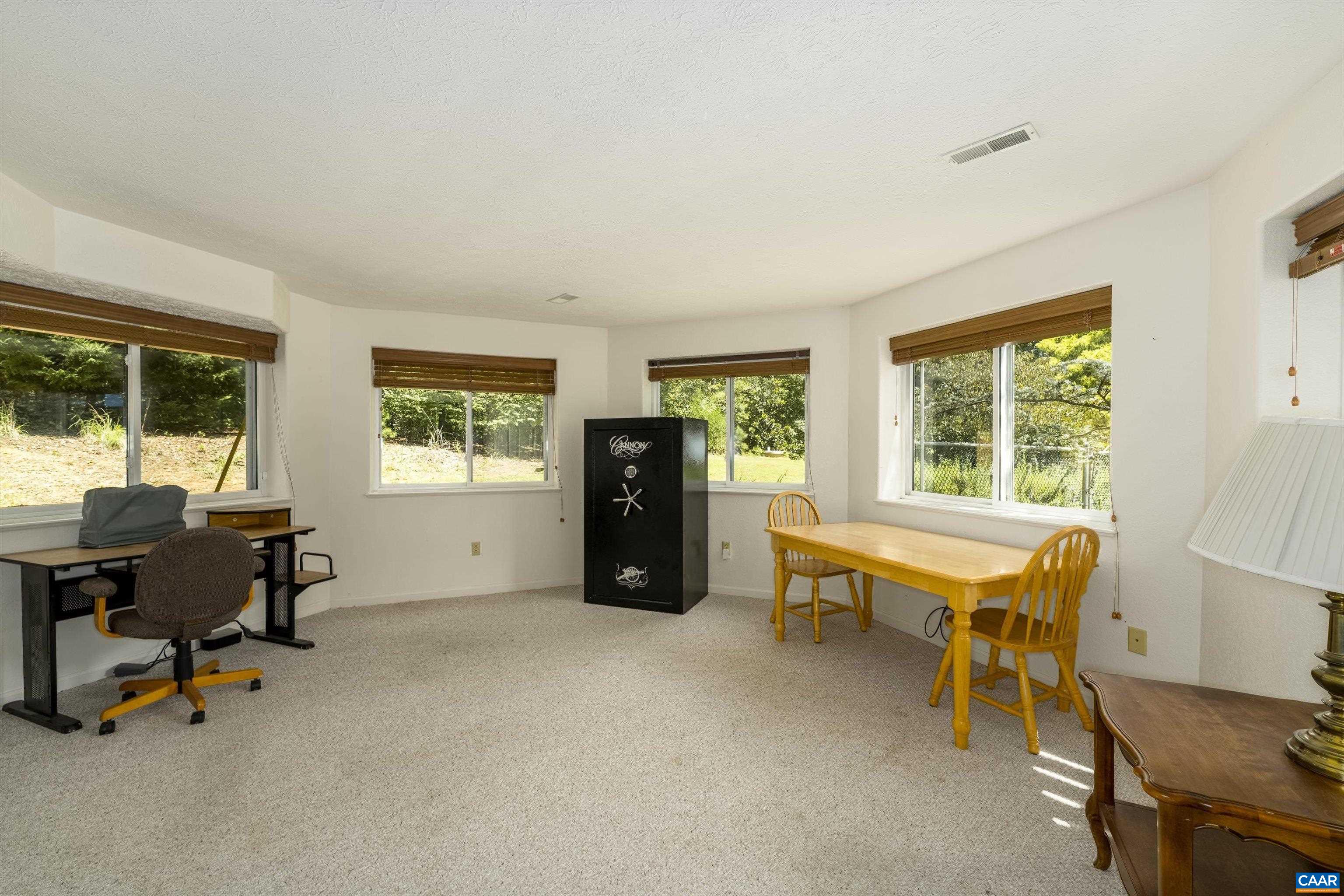 15365 Madison Run Road Gordonsville, VA 22942 - Photo 25 of 38 a view of a workspace with furniture and a window