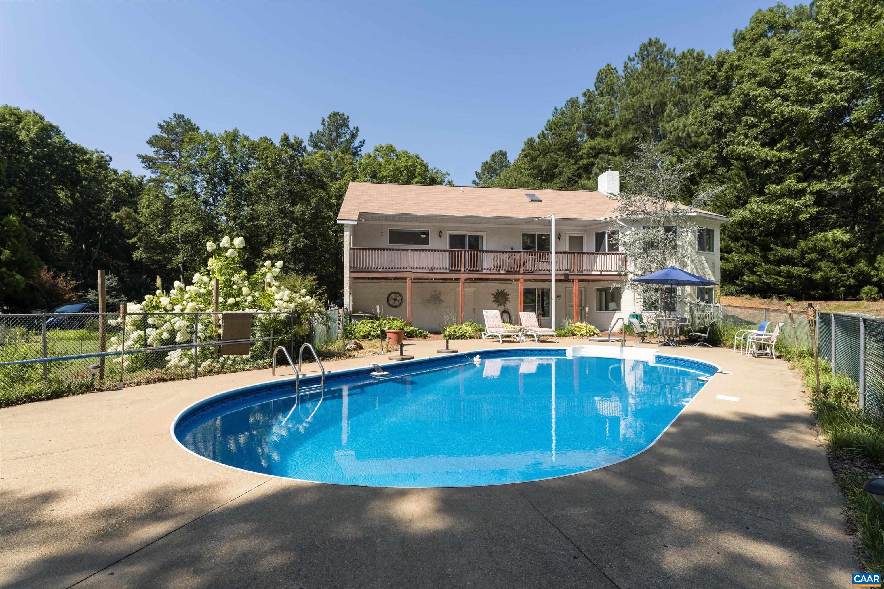 15365 Madison Run Road Gordonsville, VA 22942 - Photo 30 of 38 a view of a swimming pool with lounge chair