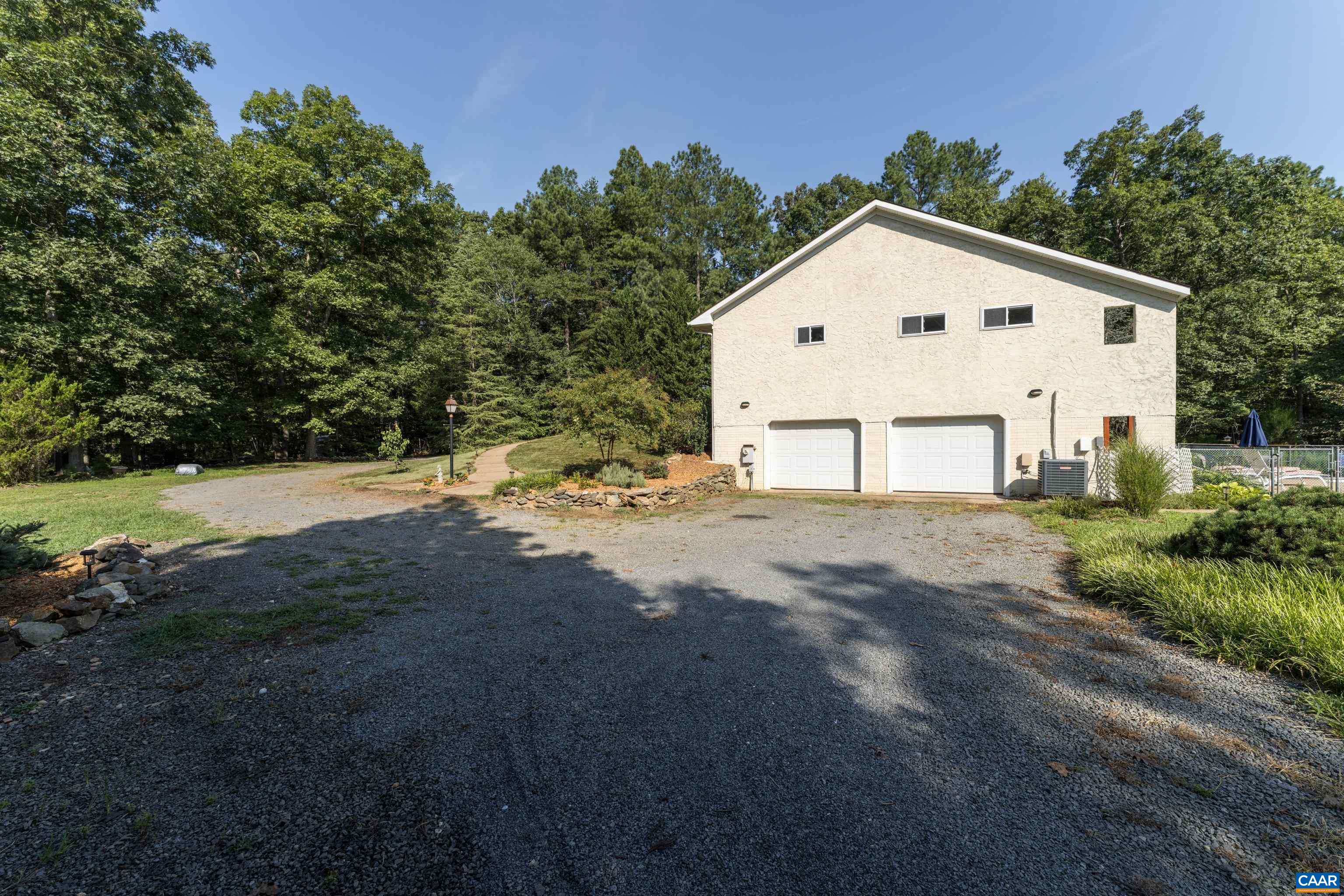 15365 Madison Run Road Gordonsville, VA 22942 - Photo 31 of 38 a view of a white house with a yard