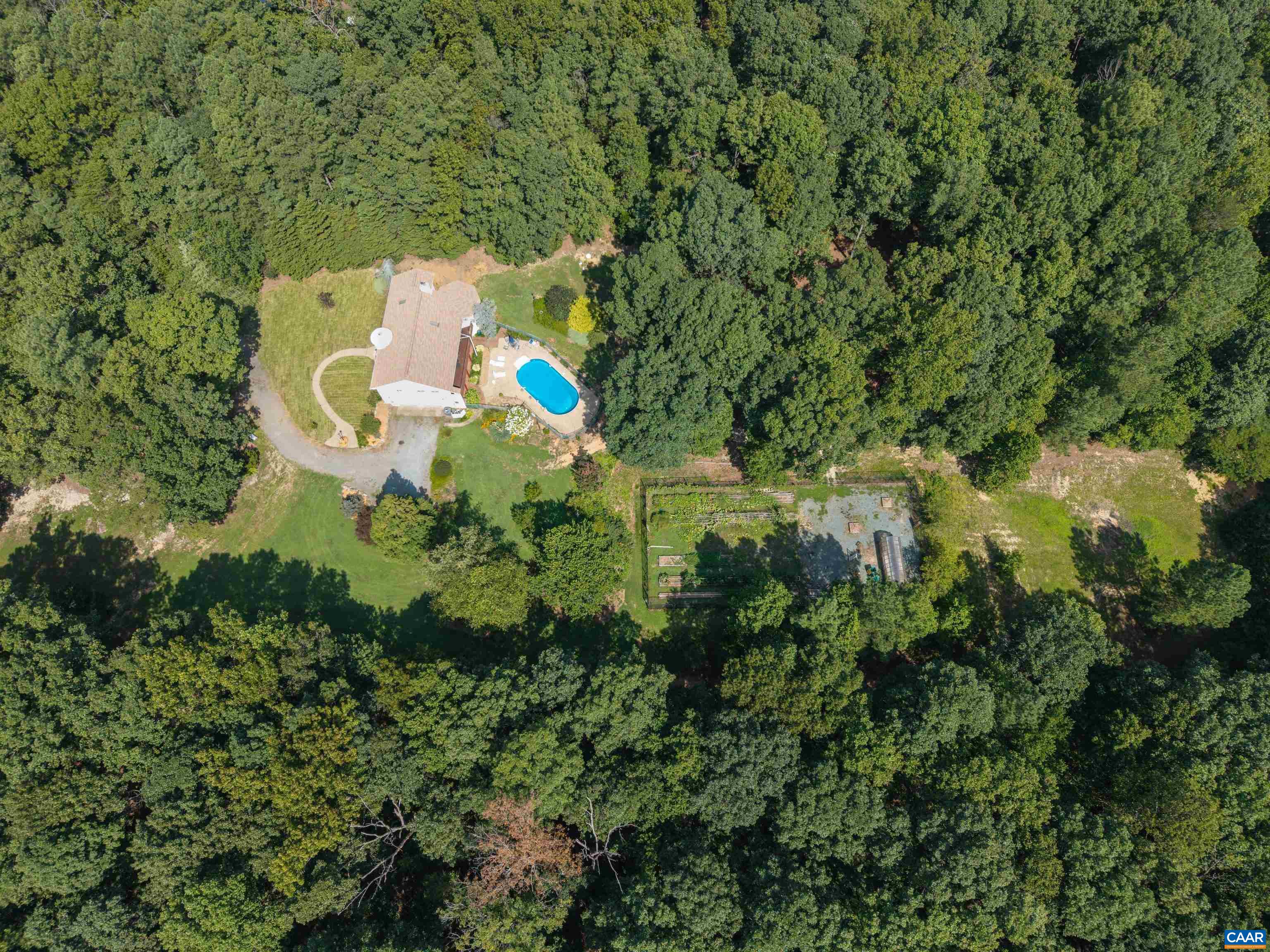 15365 Madison Run Road Gordonsville, VA 22942 - Photo 35 of 38 an aerial view of a house with a yard and large trees