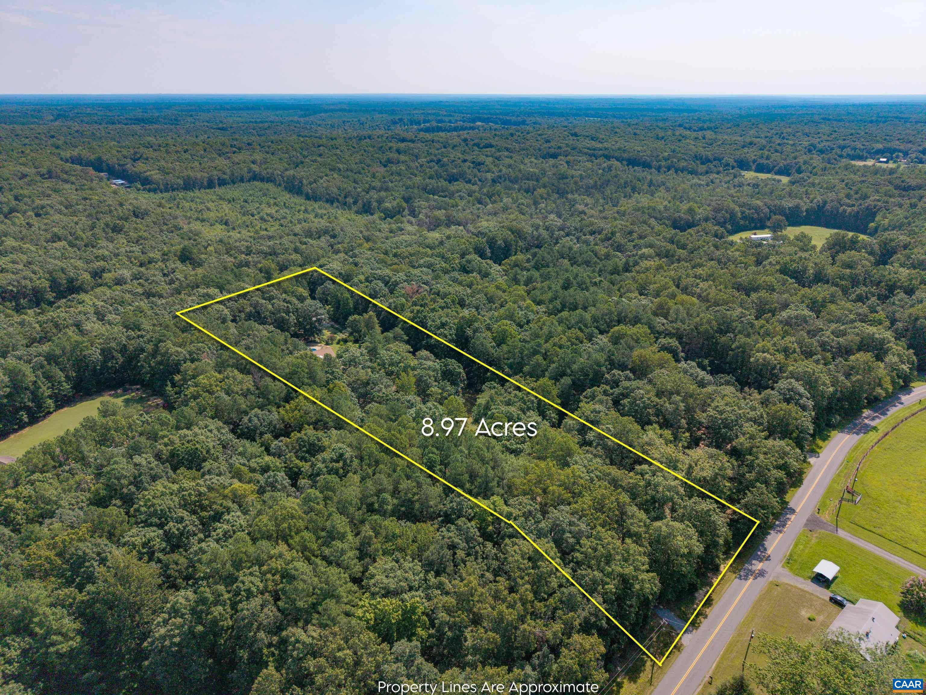15365 Madison Run Road Gordonsville, VA 22942 - Photo 36 of 38 an aerial view of residential houses with outdoor space and trees