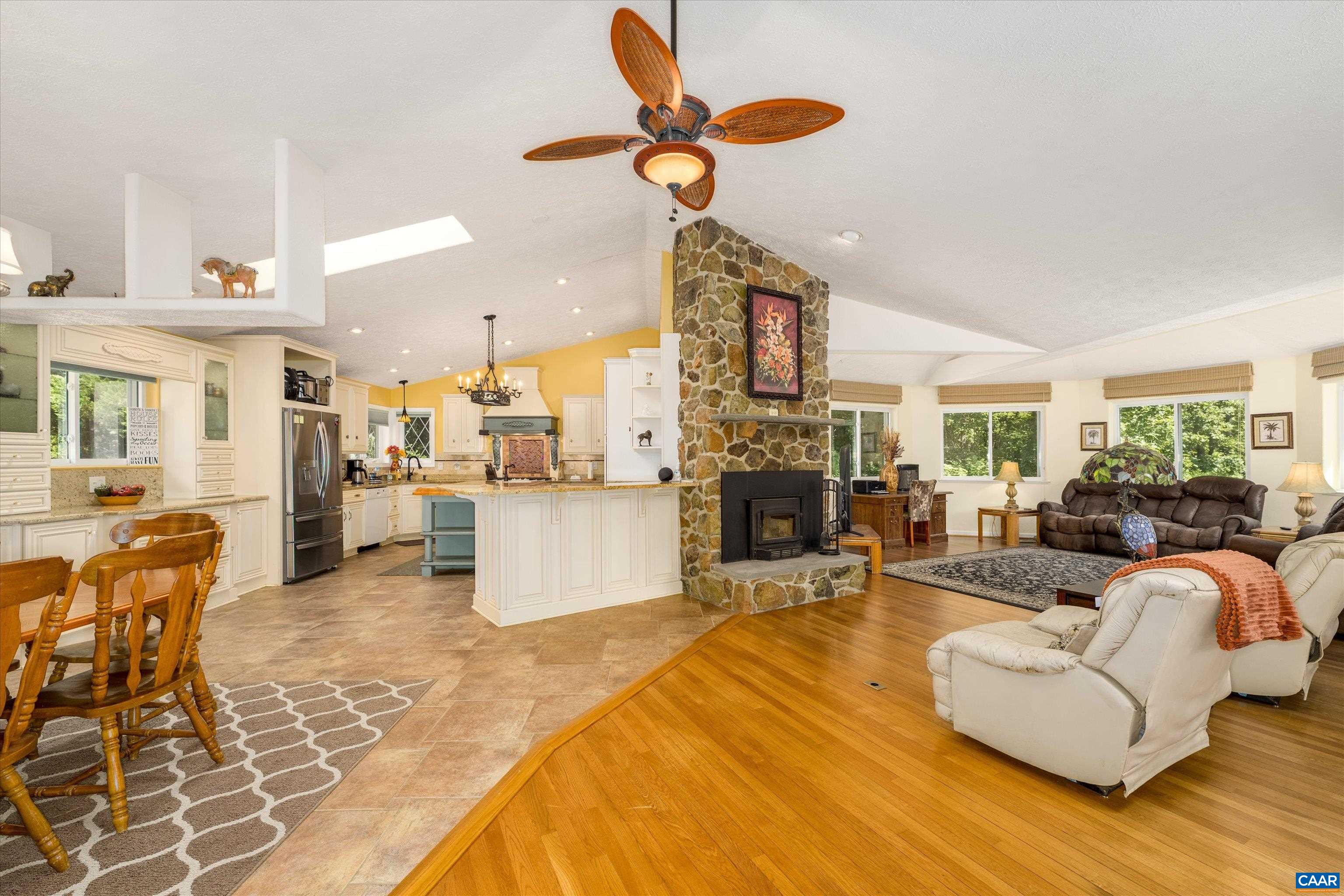 15365 Madison Run Road Gordonsville, VA 22942 - Photo 4 of 38 a living room with fireplace furniture and a chandelier