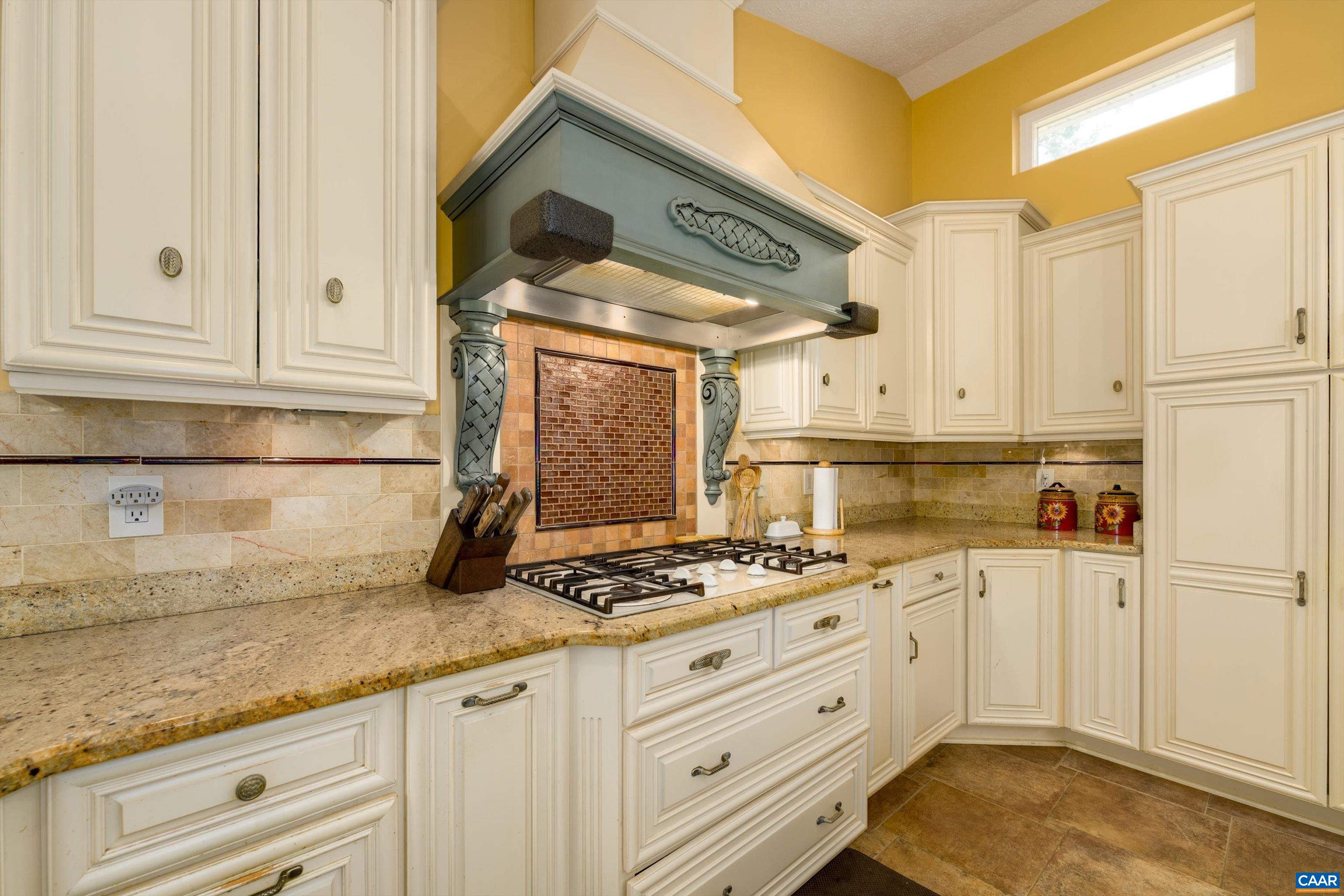 15365 Madison Run Road Gordonsville, VA 22942 - Photo 7 of 38 a kitchen with granite countertop a sink a stove and cabinets