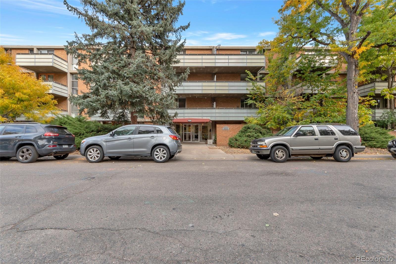a view of a cars parked in front of a building