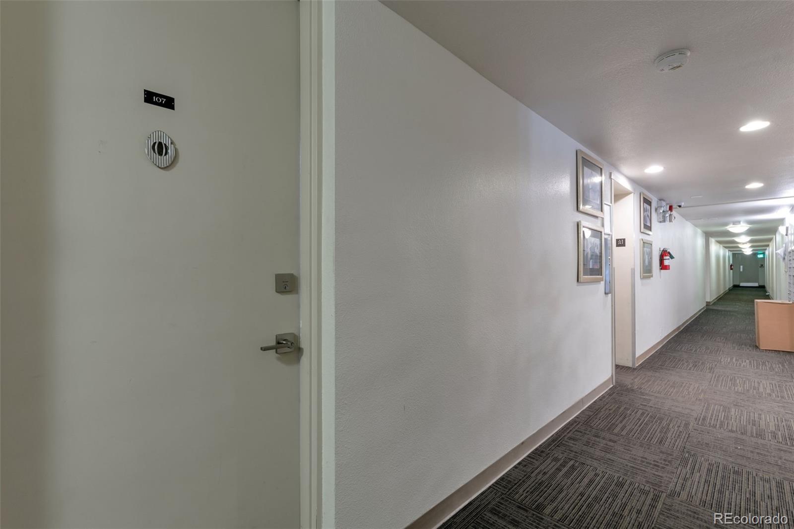 2500 South York Street, Unit 107 Denver, CO 80210 - Photo 12 of 21 a view of a hallway with closet