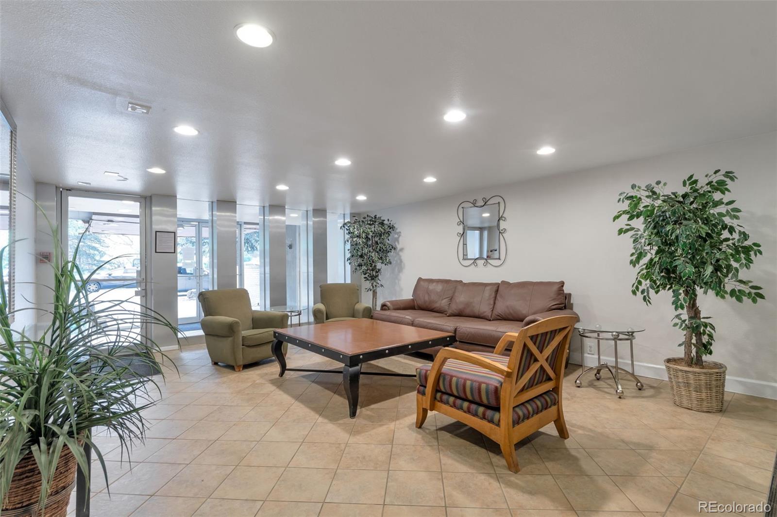 2500 South York Street, Unit 107 Denver, CO 80210 - Photo 13 of 21 a living room with furniture and a potted plant