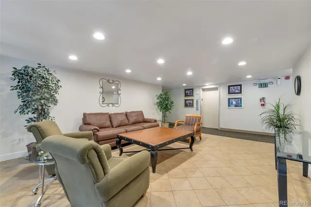 a living room with furniture plant and a potted plant