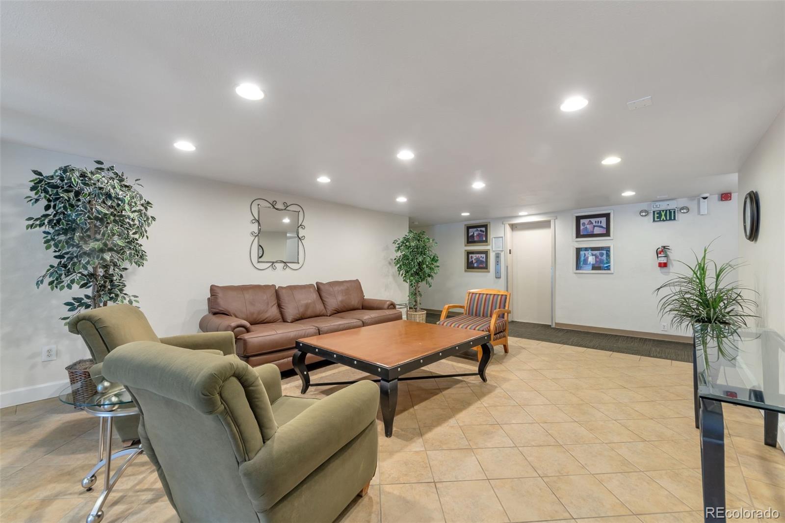 2500 South York Street, Unit 107 Denver, CO 80210 - Photo 14 of 21 a living room with furniture plant and a potted plant