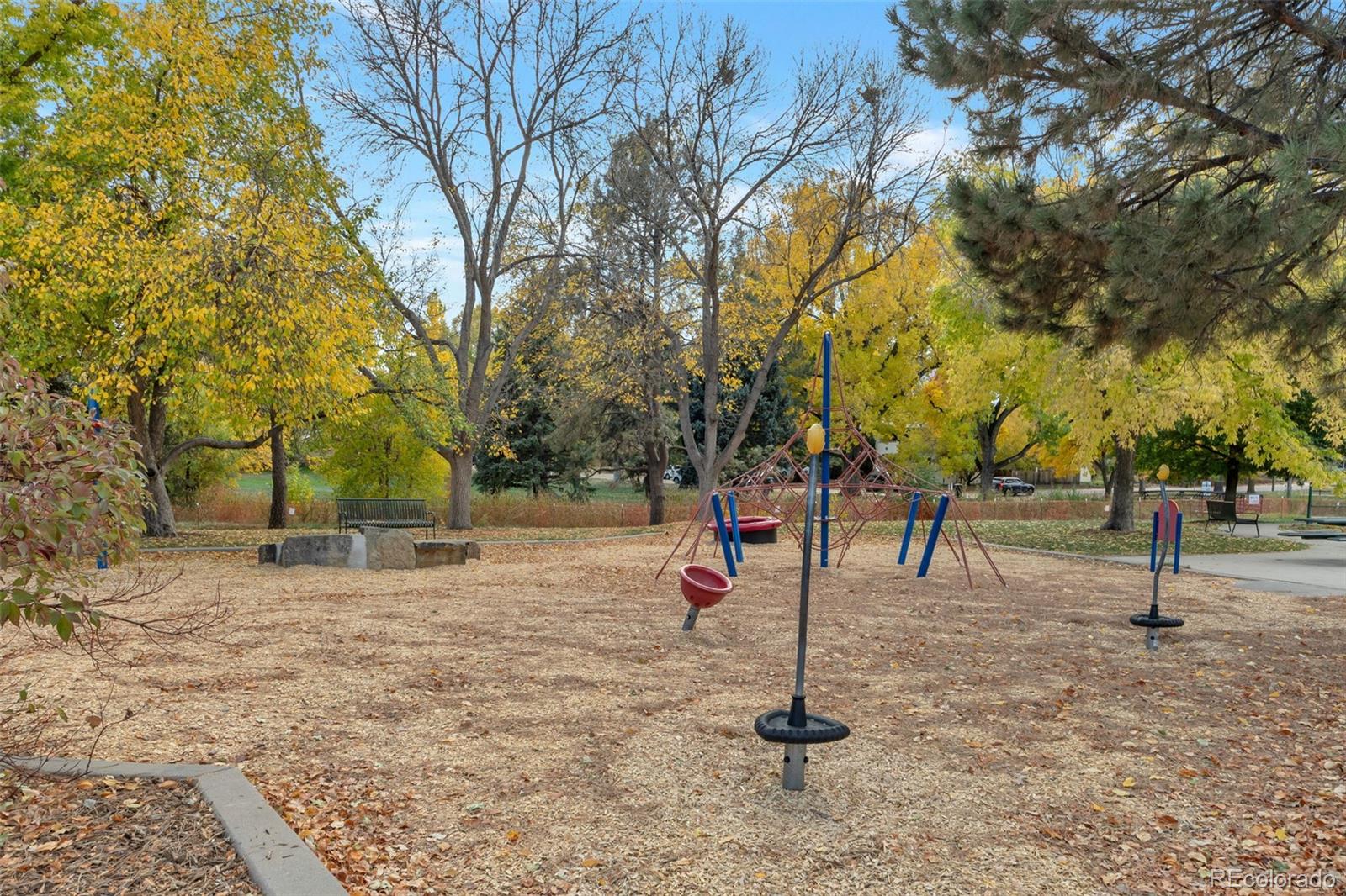 2500 South York Street, Unit 107 Denver, CO 80210 - Photo 17 of 21 a ground with lots of trees