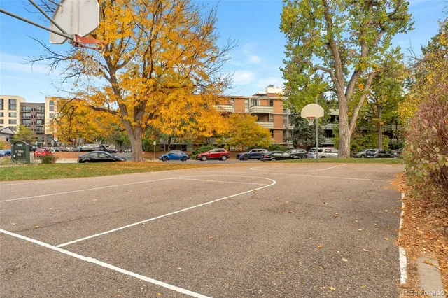 a view of street with parked cars