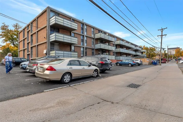 a view of a cars parked in front of a building
