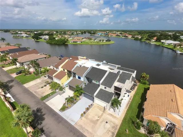 an aerial view of a house with a lake view