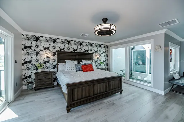 a bathroom with a granite countertop sink a refrigerator and a mirror