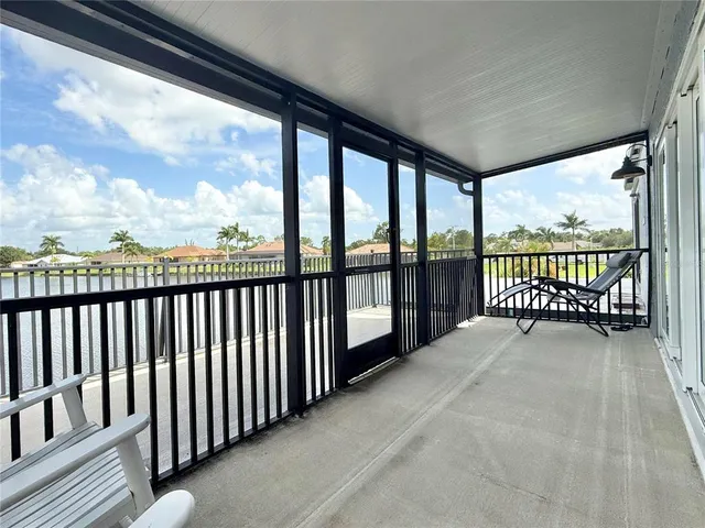 a bedroom with bed window and a table