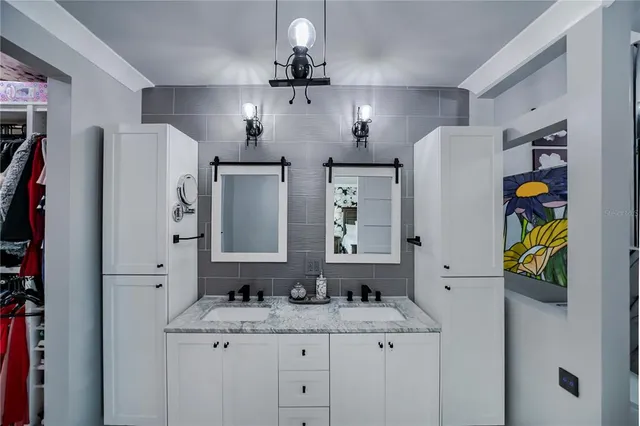 a bathroom with a shower a toilet and a sink