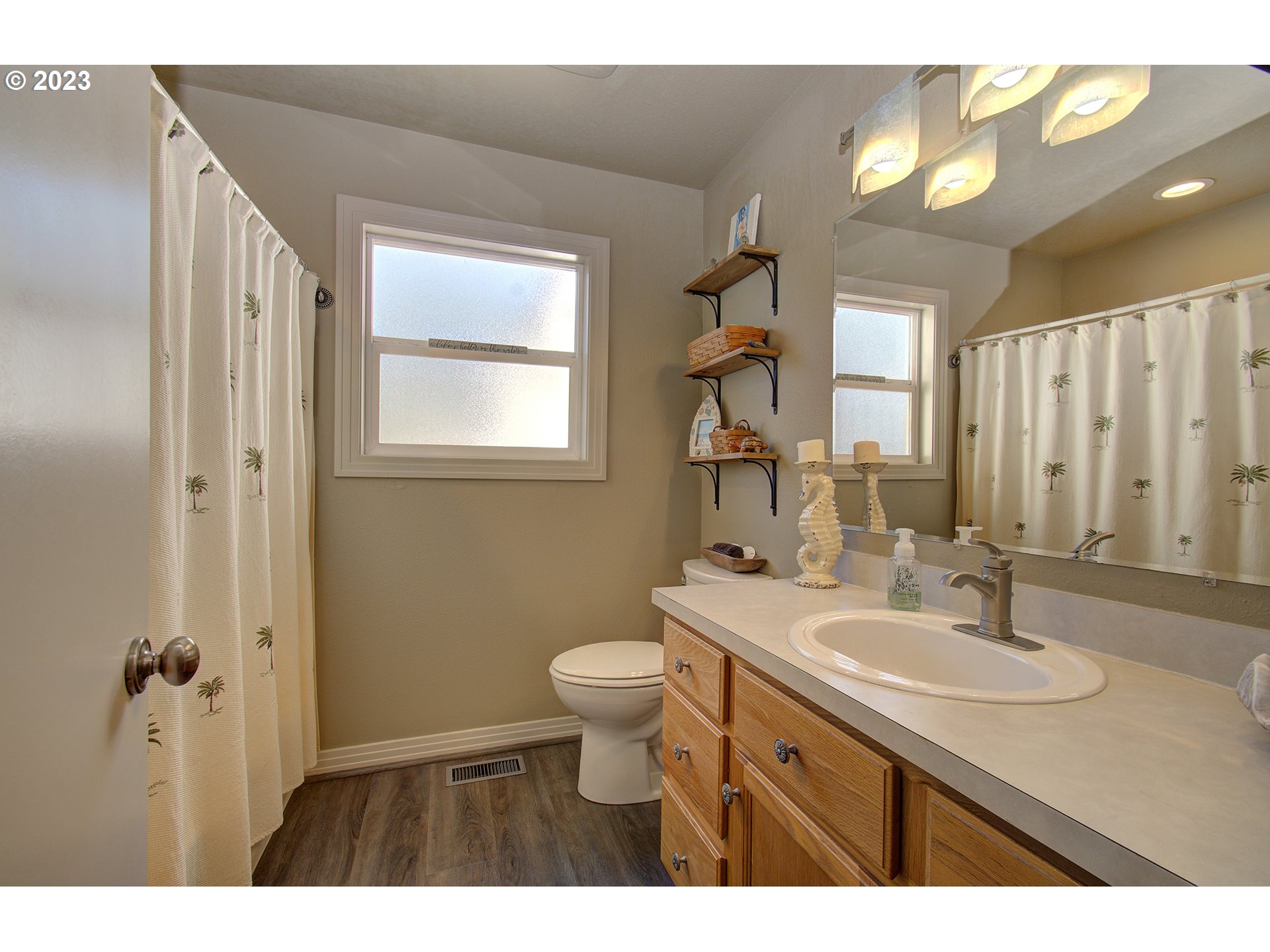 4702 Northeast 199th Street Ridgefield, WA 98642 - Photo 12 of 32 a bathroom with a sink and a mirror