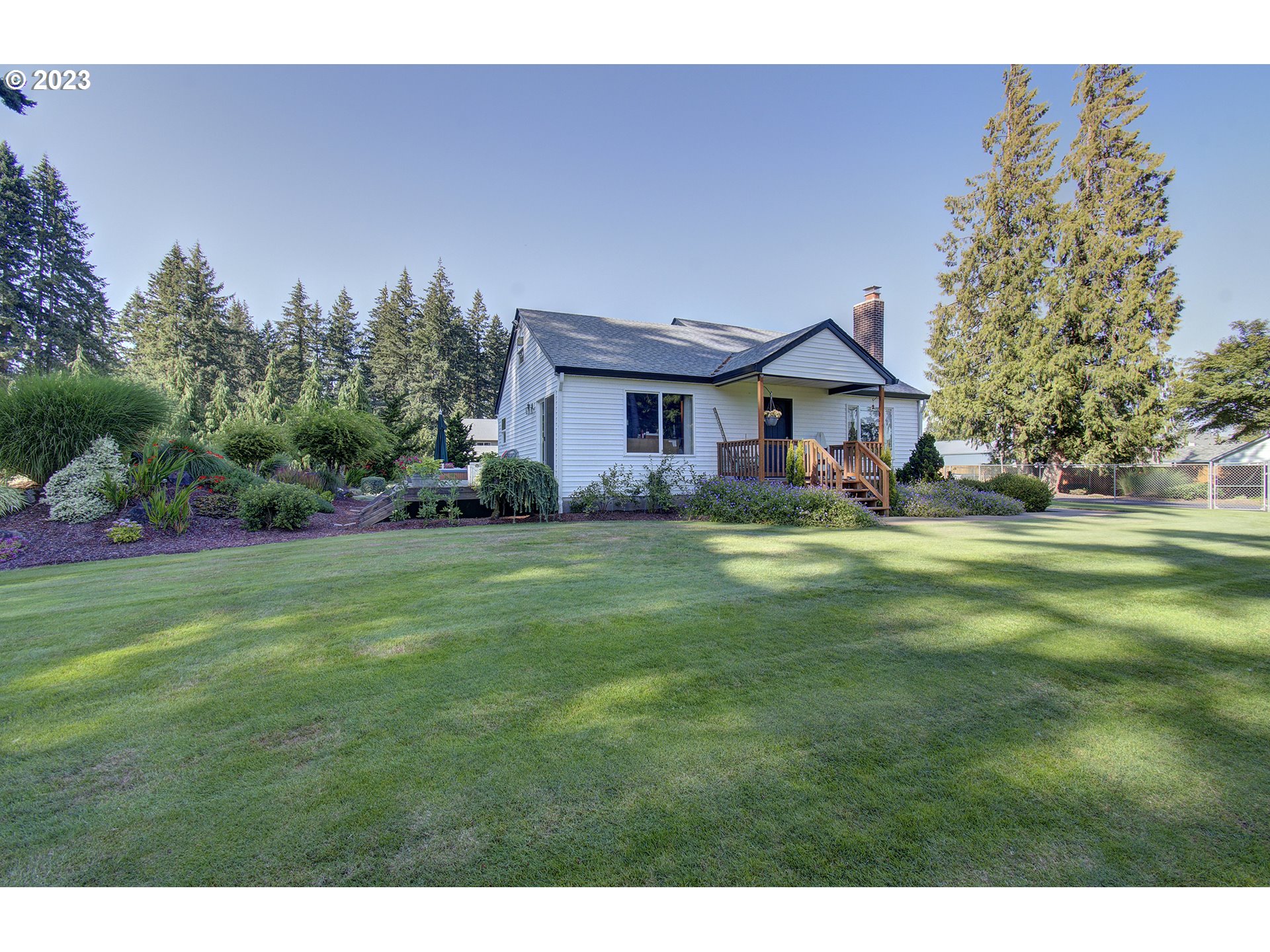 4702 Northeast 199th Street Ridgefield, WA 98642 - Photo 2 of 32 a front view of house with yard and green space