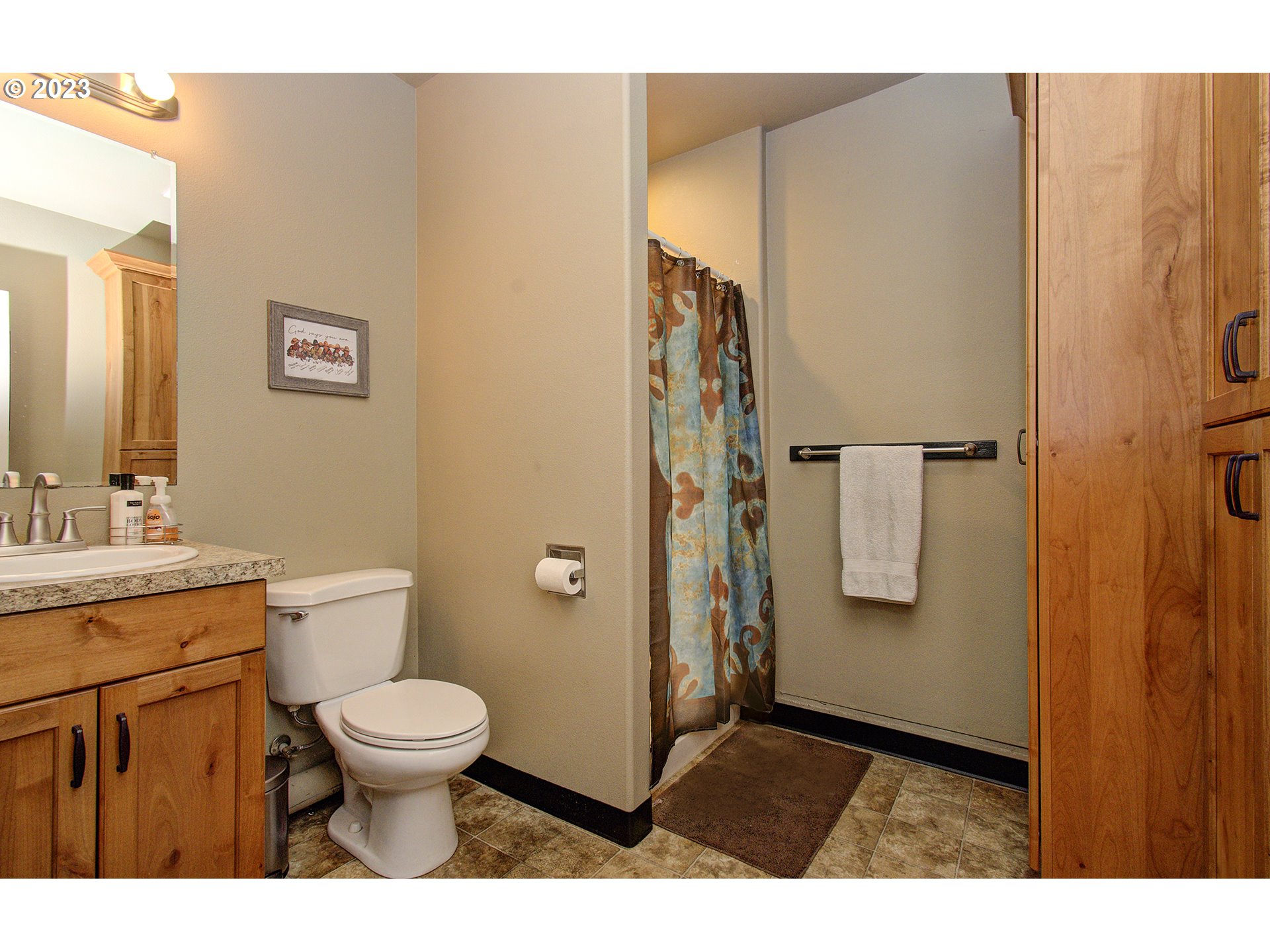 4702 Northeast 199th Street Ridgefield, WA 98642 - Photo 23 of 32 a bathroom with a toilet a sink and a mirror