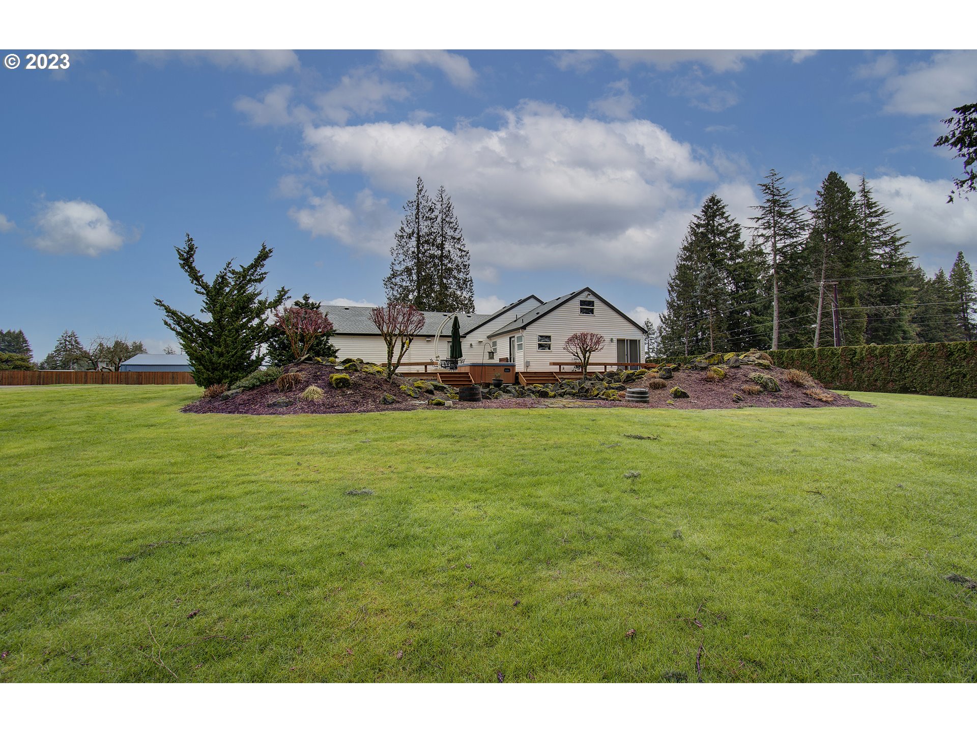 4702 Northeast 199th Street Ridgefield, WA 98642 - Photo 29 of 32 a view of an house with backyard space and garden