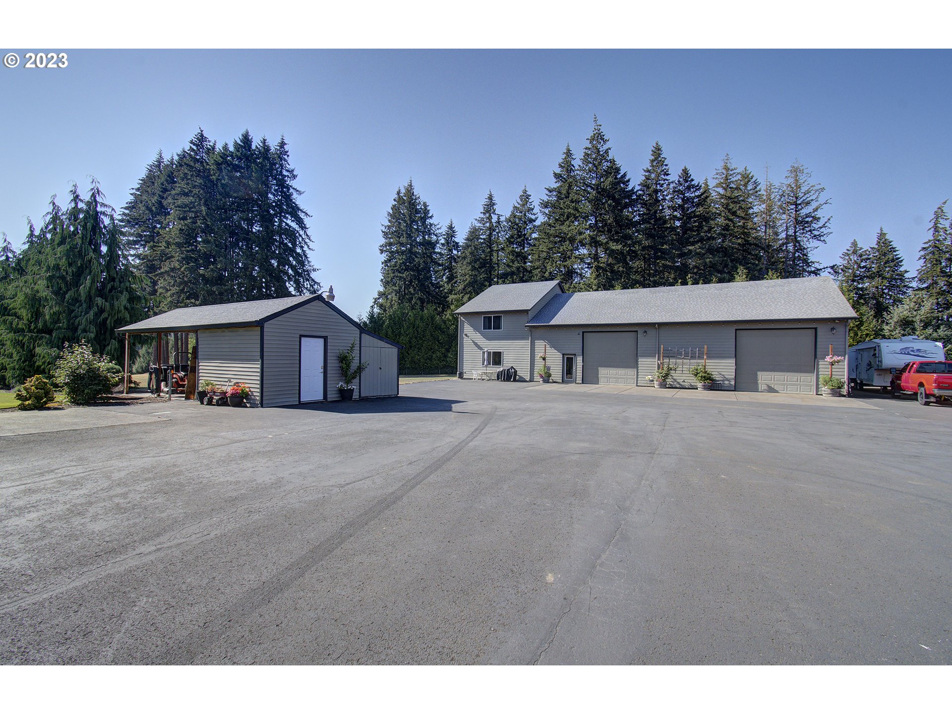 4702 Northeast 199th Street Ridgefield, WA 98642 - Photo 3 of 32 a front view of a house with a trees and mountain view