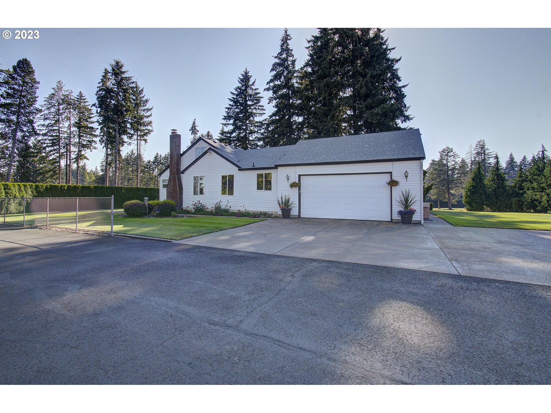 4702 Northeast 199th Street Ridgefield, WA 98642 - Photo 4 of 32 a view of house with outdoor space and lake view