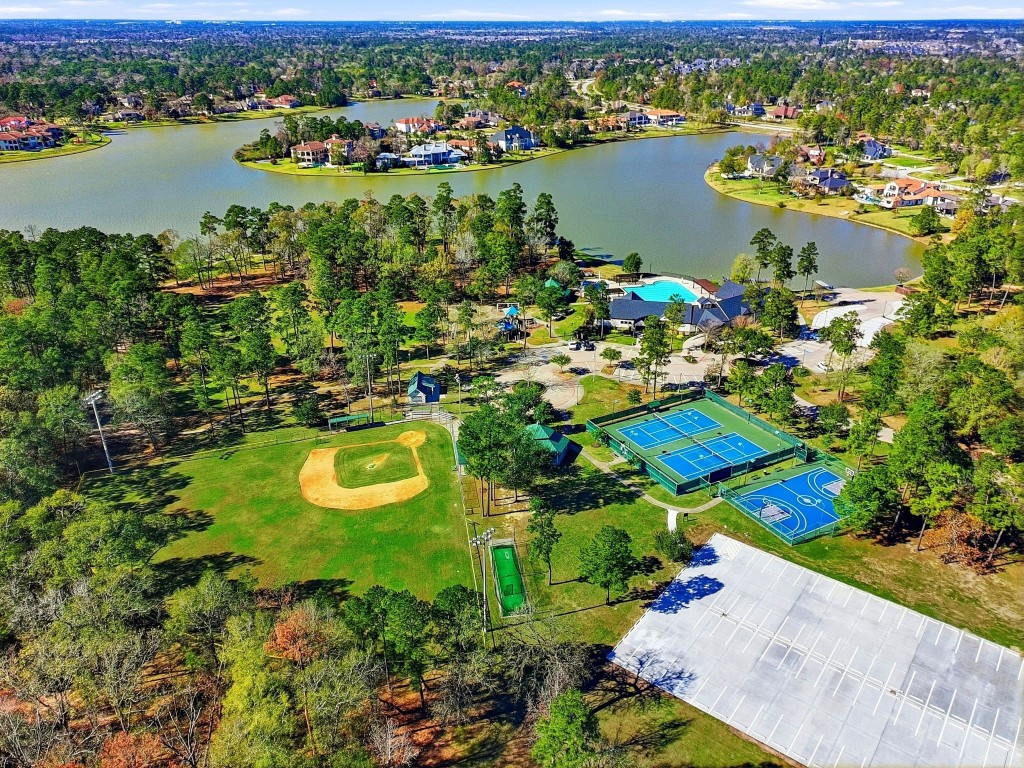 27560 South Lazy Meadow Way Spring, TX 77386 - Photo 24 of 42 an aerial view of lake residential houses with outdoor space and ocean view