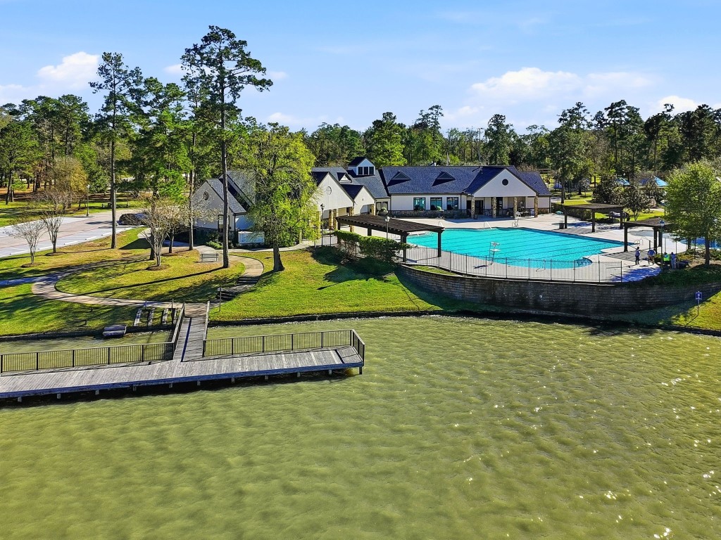 27560 South Lazy Meadow Way Spring, TX 77386 - Photo 27 of 42 a view of a swimming pool with a yard