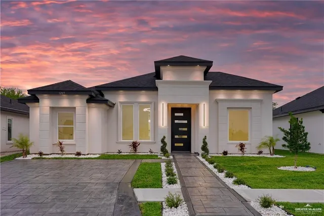 front view of a house with a yard