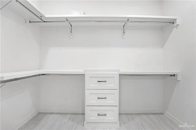 a view of an empty walk in closet