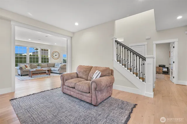 a living room with furniture and a rug