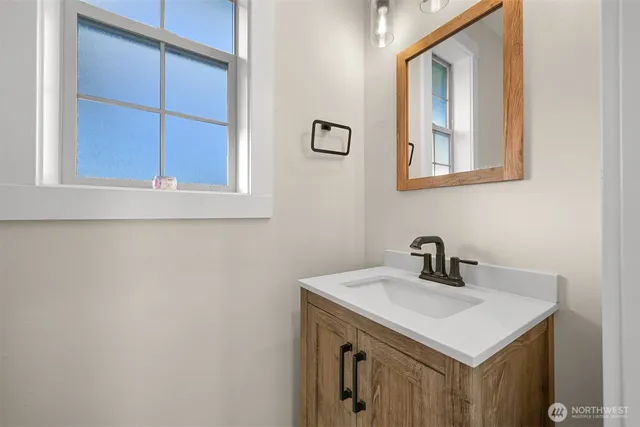 a bathroom with a sink and a mirror