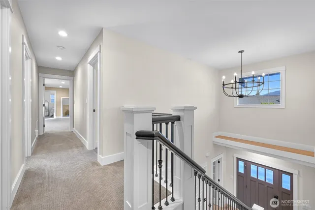 a view of a hallway with a chandelier