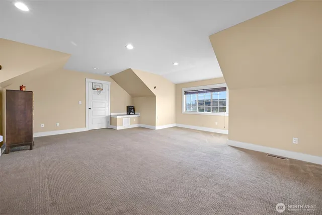 a view of empty room with windows