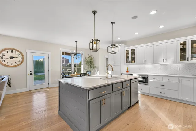 a kitchen with counter top space cabinets and stainless steel appliances
