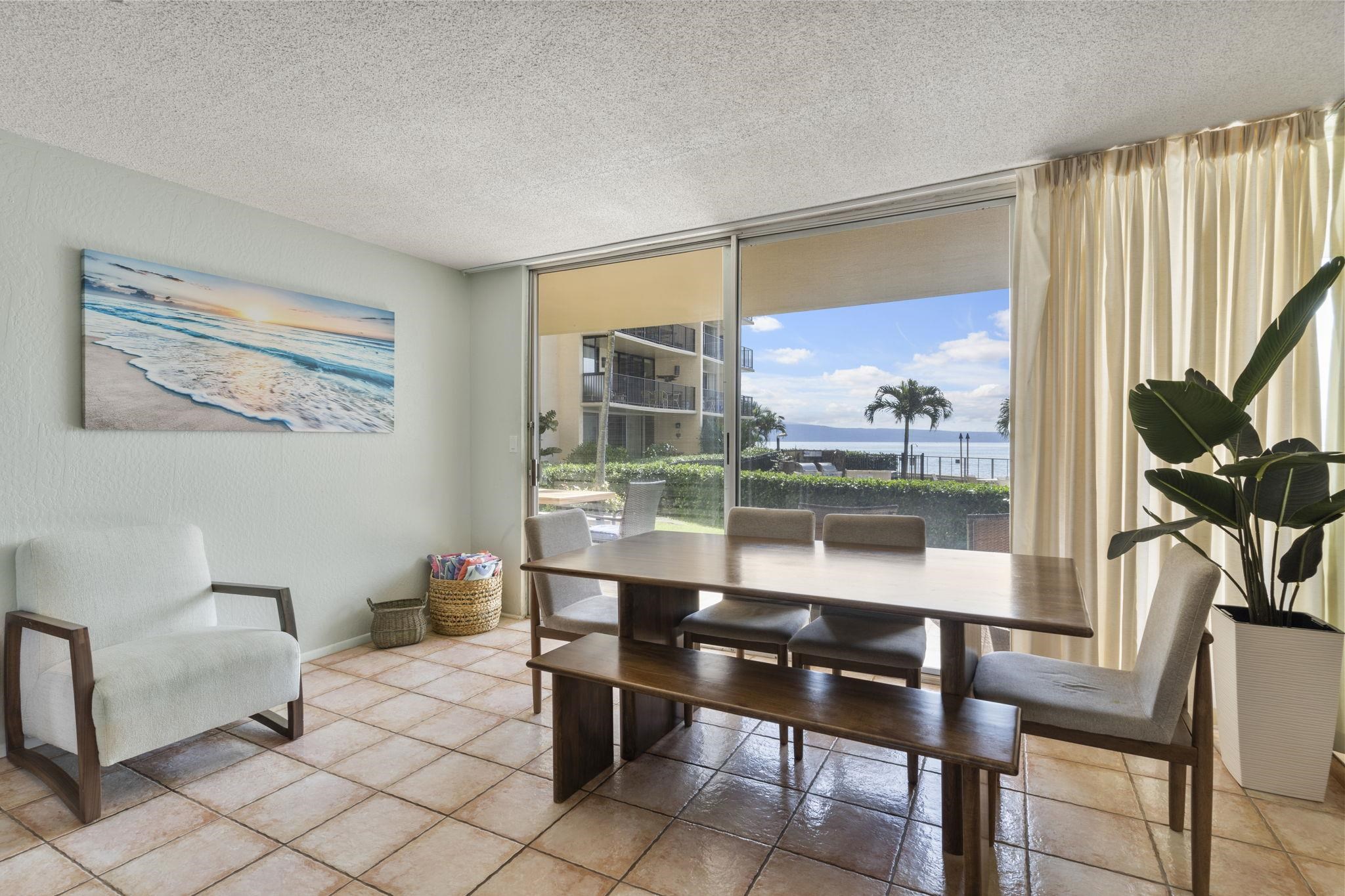 4401 Lower Honoapiilani Road, Unit A101 Lahaina, HI 96761 - Photo 14 of 37 a view of a dining room with furniture window and outside view