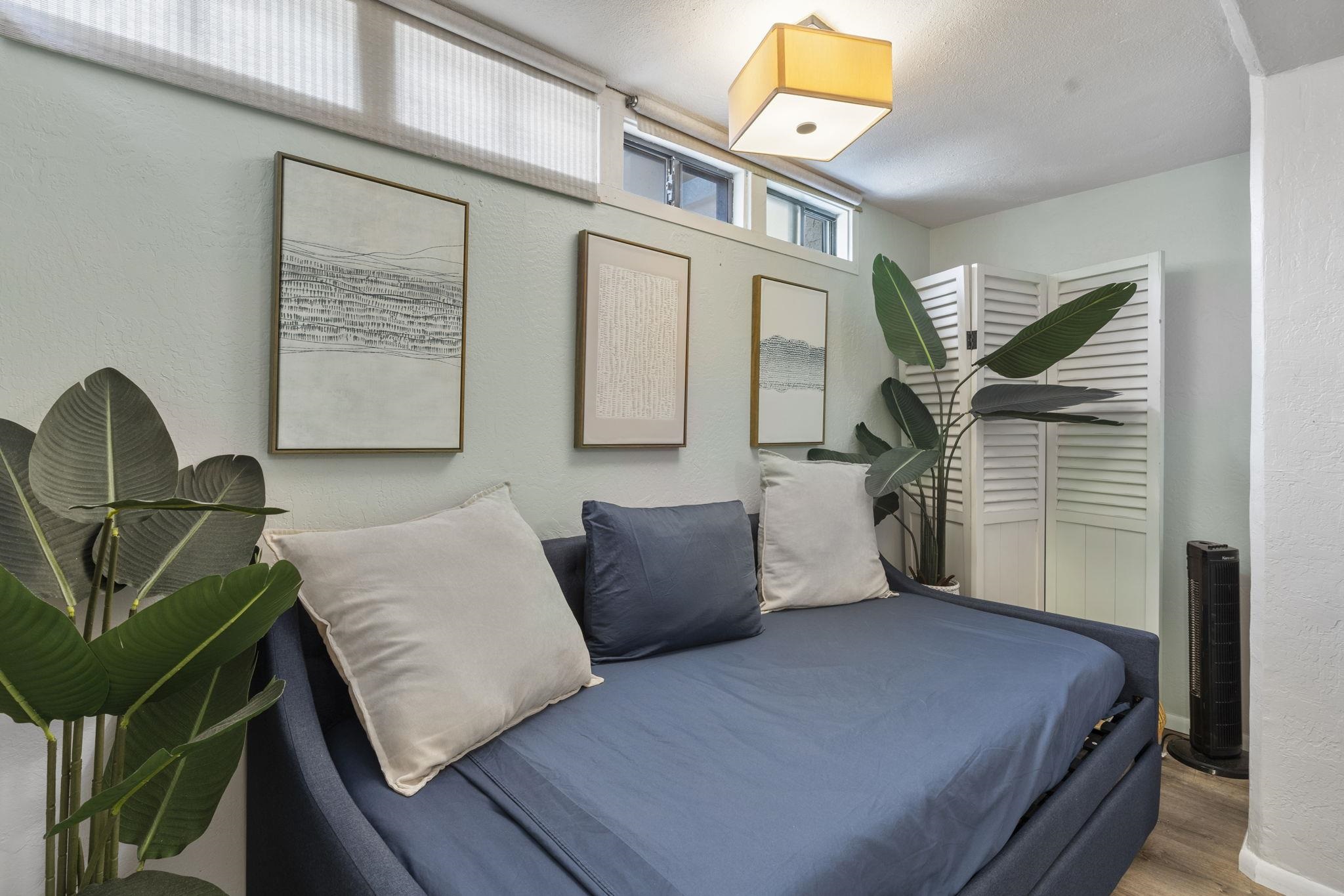 4401 Lower Honoapiilani Road, Unit A101 Lahaina, HI 96761 - Photo 26 of 37 a bedroom with furniture and a window