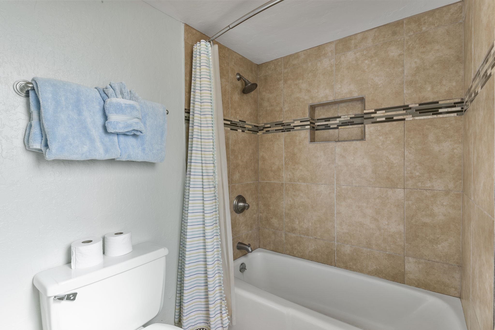 4401 Lower Honoapiilani Road, Unit A101 Lahaina, HI 96761 - Photo 32 of 37 a bathroom with a bathtub and a shower