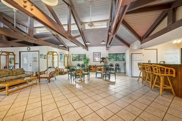 a view of a patio with table and chairs