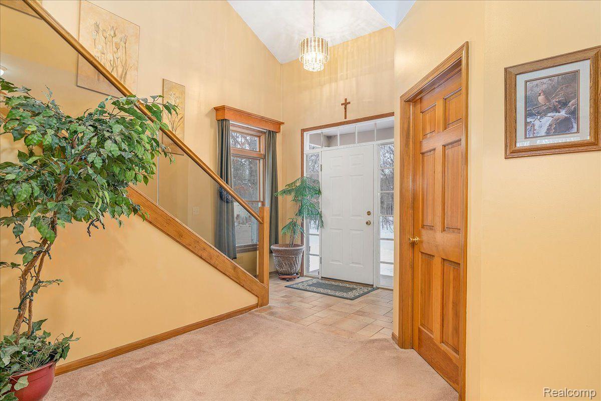 21851 Prince Road Belleville, MI 48111 - Photo 7 of 59 Two-story foyer with chandelier